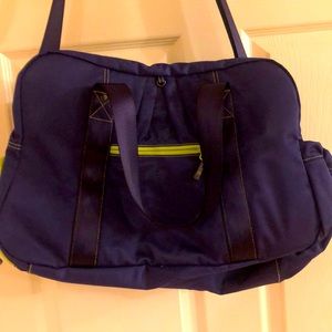 VGUC Athleta gym bag. Shoulder strap tons pockets holds a lot deep purple w lime